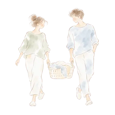 Two adults carrying a laundry basket together.